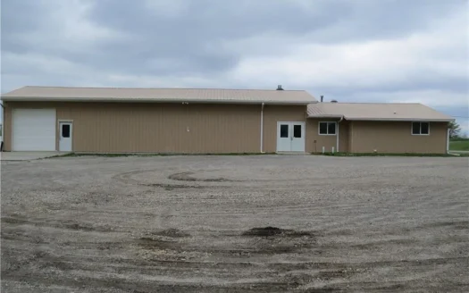 65,936 sq ft Facility with Large Parking Area and Garage