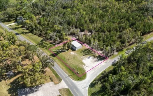 Prime Development Option .50-Acre Corner Lot with Steel Building