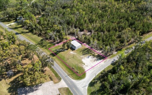 Prime Development Option .50-Acre Corner Lot with Steel Building
